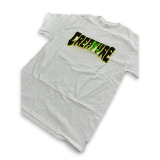 White Creature Skateboards tee with bold green and black Creature logo graphic