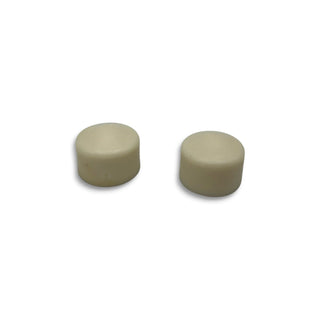 Two white cylindrical Mini Logo skateboard pivot cups on white background
