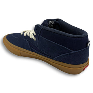 Vans Skate Half Cab mid-top sneaker in navy suede with gum sole and cream laces