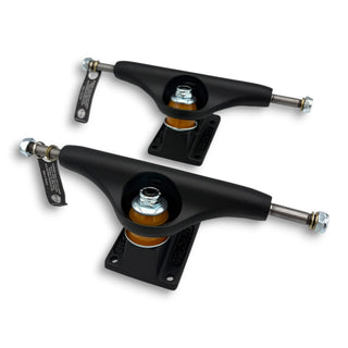 Pair of Independent Stage 11 Blackout matte black skateboard trucks with orange bushings