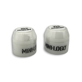 Two white Mini Logo medium 94A skateboard bushings shown from an angled view