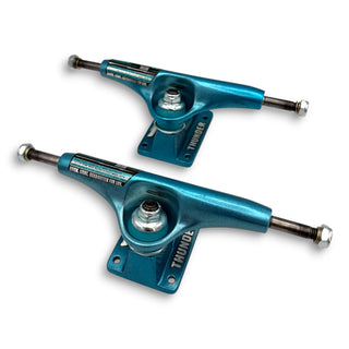 Thunder 149 skateboard trucks in metallic ice blue, pair shown front and back