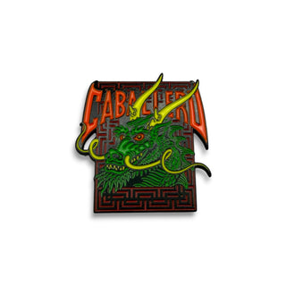 Powell Peralta Caballero Street Dragon green enamel lapel pin with red maze background
