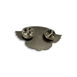Back view of Powell Peralta Winged Ripper lapel pin showing two silver butterfly clutch fasteners