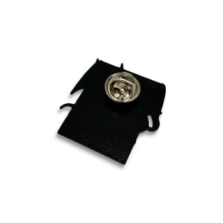 Back view of black enamel lapel pin with silver butterfly clutch fastener